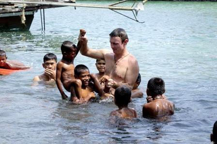 Philip swimming with a group of Moken boys in the shallows off Koh Phayam