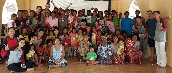 The island church family and visitors gathered for a big group photo