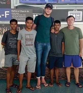 Philip and three of the boys at the Phuket airport check-in, seeing their South African friend off